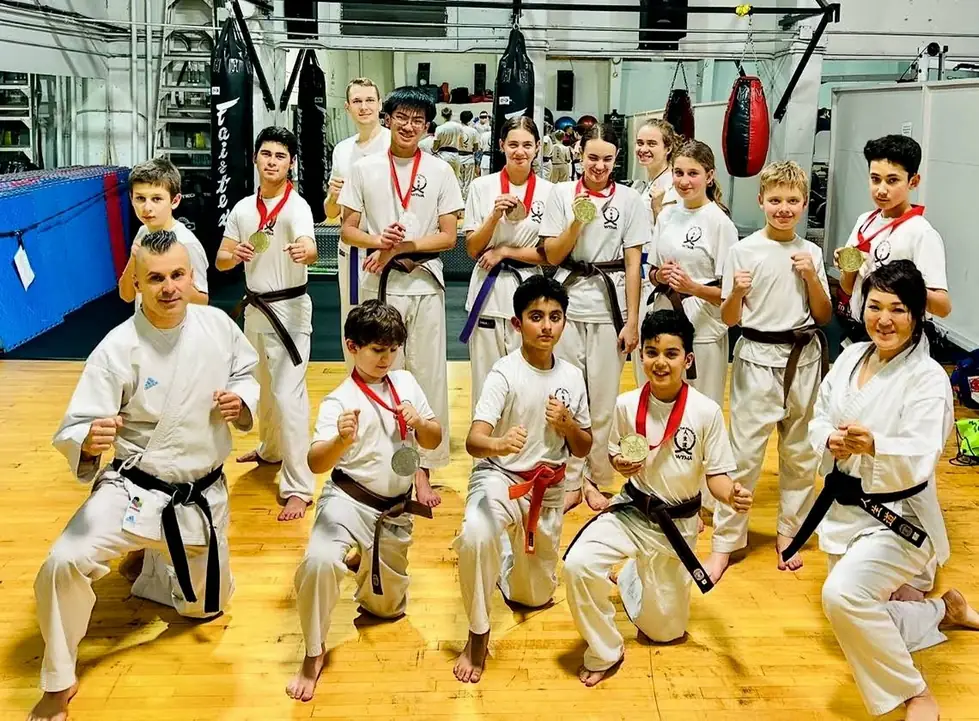 World Top Martial Arts students with medals in the dojo